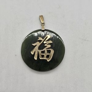 Green stone and gold tone Chinese luck pendant